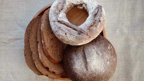 Baked Bread Loaf of Bread Fresh Bakery Products on Wooden Board Healthy Food Concept Top View Slices