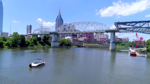 Nashville, TN / April 5, 2016: Ferry Heading Up Nashville River, Cityscape