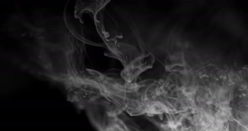 Two big waves of white smoke run down from the top and fill the entire frame with a white haze