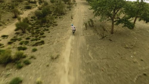 Motorcyclist Climbs on Dusty Hill Fpv