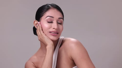 Beautiful Young Woman Posing with Hand Under Chin