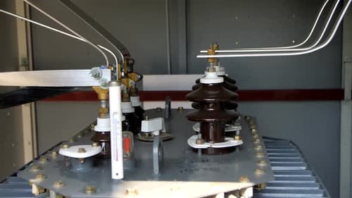 Lines of Insulators with Metal Connectors Inside Switchbox