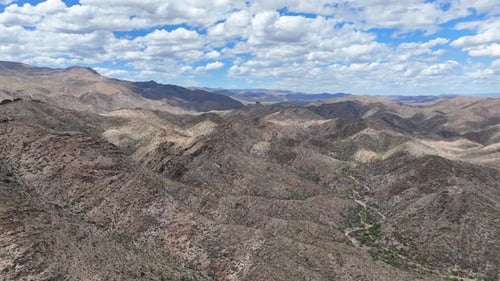 Aerial view of rugged mountains and barren terrain, United States.