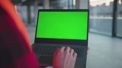Close Up Hands Engineer Using Laptop Computer with Green Screen Typing Inside Building Worker