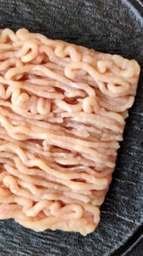 Raw fresh ground chicken, turkey, or pork for burgers or meatballs. Raw ground chicken