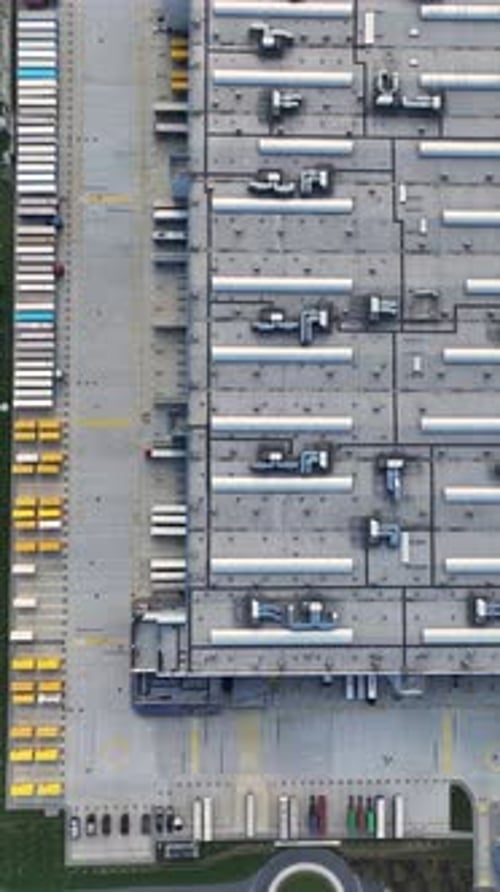 Aerial view of a large warehouse and loading area in a distribution center