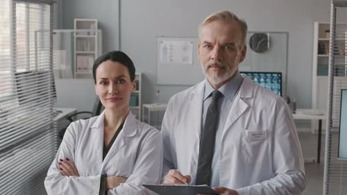 Confident Doctors Posing in Hospital Office