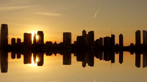 silhouette of skyline city panorama view at sunset magic hour light