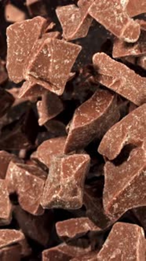 Super Slow Motion Pieces of Dark Milk Chocolate Filmed on a Highspeed Camera at 1000 Fps