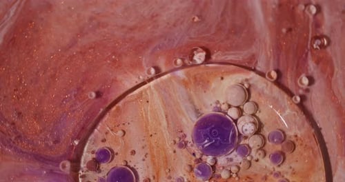 Abstract Spheres of Shimmering Liquid in Swirling Motion