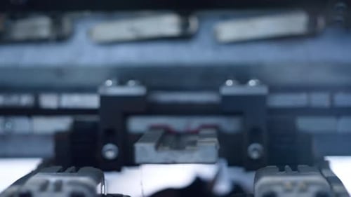 Industrial machine processing and assembling, close up