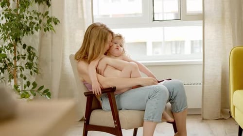 Loving Mother and Child in Cozy Armchair