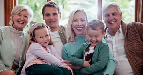 Family Portrait with Three Generations Smiling Indoors