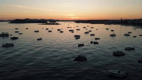Sail boats and yachts docked and beautiful golden colors. Panoramic landscape with boats in marina b