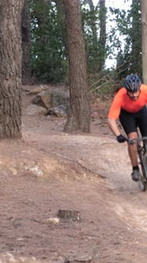Vertical Video Man Riding Mtb Mountain Bike Through Forest