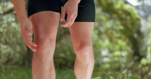 Knee pain, legs and park runner man, athlete and training, workout and exercise on outdoor nature
