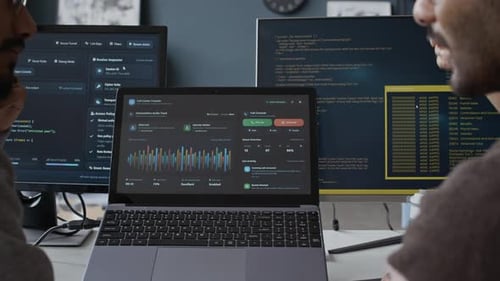 Indian Young Male Programmers Analyzing Software in Office