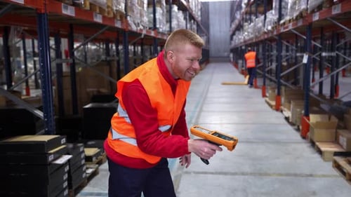 Warehouse Worker Scanning and Dancing with Barcode Scanner