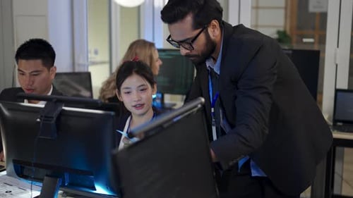 Group of programmers are coding at office.