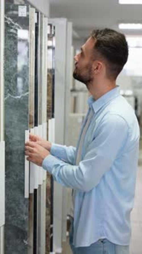 A Man Looking Tiles for Bathroom or Kitchen Vertical Video