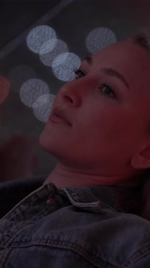 Young Woman in City at Night