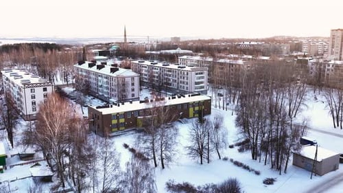 Public Building with Large Snowy Yard in Winter City