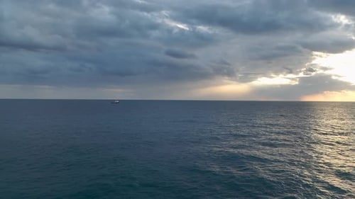 Tugboat's Return Aerial View of Sunset and Rainbow Over Port