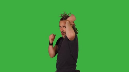 Male Fighter Doing Fight Boxing Practice Training Isolated on Green Screen