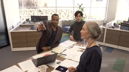 Multiracial business team collaboration and planning in modern creative office