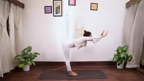 Video of woman performing Padhastaasan