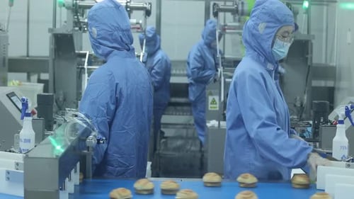 Mass production packaging of pastry gourmet hand-shredded bread products. Factory made packaged croi