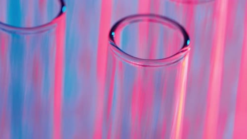 Close Up Video Neon Blue and Red Light Test Tubes in a Laboratory Scientific Experiment Research