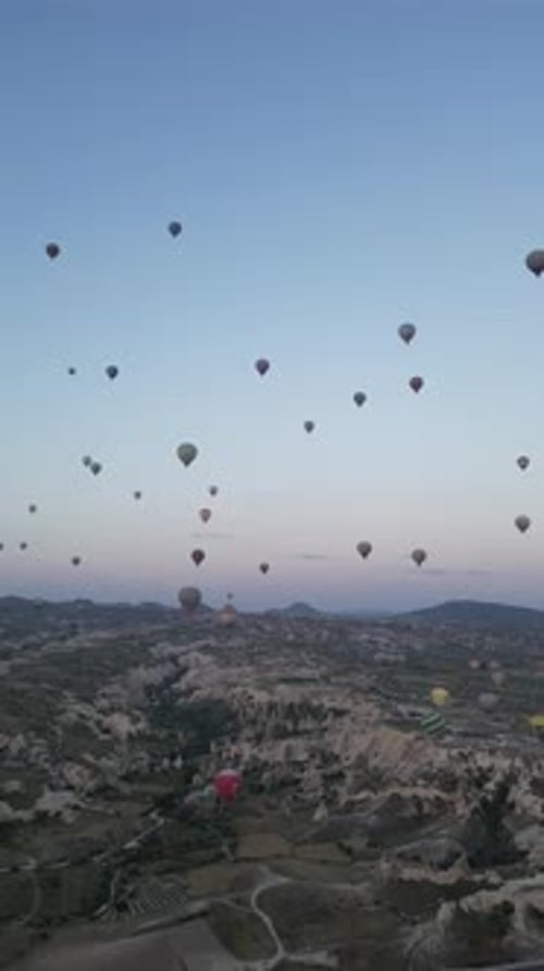 Aerial video over monoliths in Cappadocia, on hot air balloons, Turkey