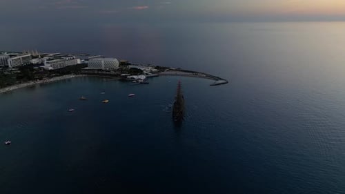 Flying Around a Pirate Ship in the Bay at Sunset
