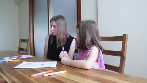 Girl and Woman Drawing Together at Table