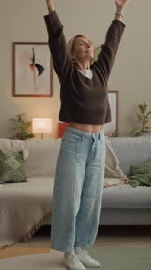 Vertical of Adult Woman Meditating and Stretching at Home