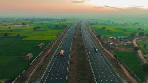 Aerial view of highway cutting through fields, India.