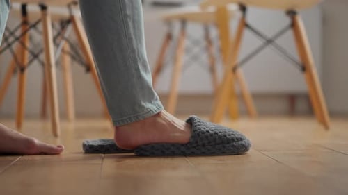 Putting On Slippers in Home Setting