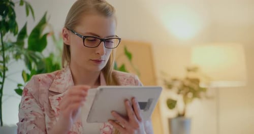 Woman Using Tablet in a Home Setting