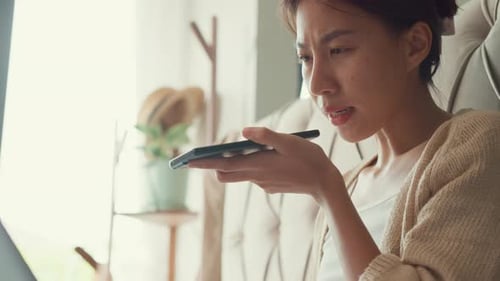 Woman Talking on Smartphone at Home, Close Up