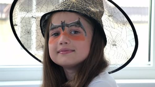 Happy Little Girl in Halloween Witch Costume