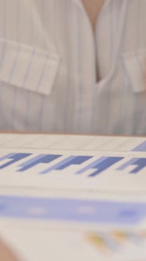 Business People Working on Documents in Office, vertical video