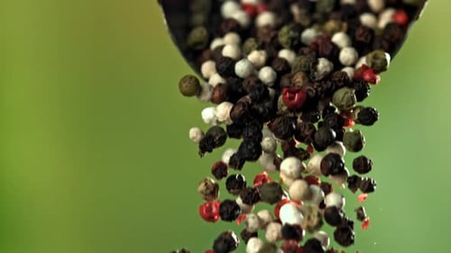 Colorful Peppercorns Being Poured in Macro Shot