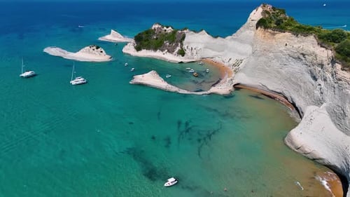 Aerial Drone Video of Cape Drastis Peroulades in North Corfu Greece Featuring Dramatic White Cliffs