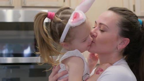 Loving Mother and Child Kissing on Easter