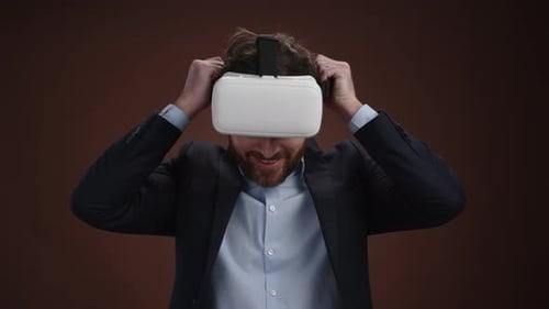Man Puts on Virtual Reality Headset in Studio