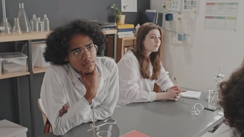 Young Adults Listening in Science Lab