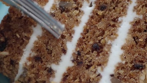 Person Use Fork Eating a Caramel Cake on Cafe