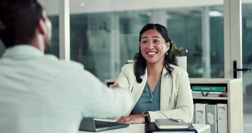 Business Meeting and Handshake in Modern Office