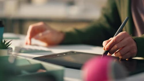 Hands Using Tablet with Stylus and Keyboard
